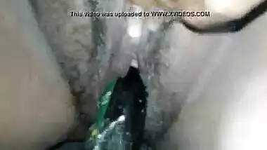 Indian horny slut using a plastic bottle as her sex toy