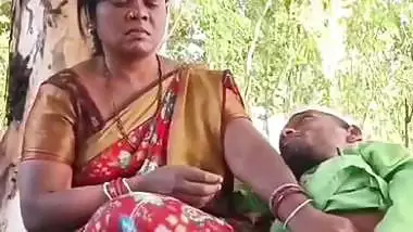 Outdoor sex of a handicapped man with a milf in the jungle