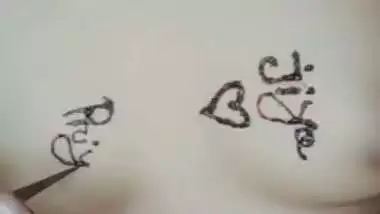 Nude girl puts henna on her naked body during a video call sex